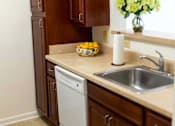 Thumbnail 9 of 14 - Modern, fully equipped kitchen with safety features in a senior apartment at Park View at Colonial Landing, a 62+ active adult community in Elkridge, MD.