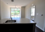 Thumbnail 2 of 8 - Living room view from kitchen.
