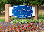 Thumbnail 1 of 9 - Mid-rise apartment building at College Parkway Place featuring elevator access, controlled entry, off-street parking, and landscaped grounds in the heart of Annapolis, MD.