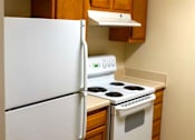 Thumbnail 9 of 9 - Well-appointed kitchen with ample cabinet space and modern appliances, part of a thoughtfully designed apartment at College Parkway Place, a family-friendly mid-rise community in historic Annapolis.