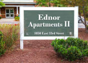 Thumbnail 3 of 17 - a sign in front of a building that says edroit apartments ii
