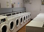 Thumbnail 13 of 15 - Convenient laundry facilities at Park Montgomery apartments located along the Purple Line in Silver Spring, MD.