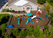 Thumbnail 6 of 8 - A playground with a slide, swings, and a ball pit.
