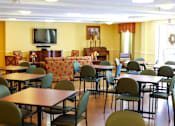 Thumbnail 10 of 15 - Spacious community room at Park View at South Pantops where residents age 62 and better enjoy social events, educational activities, and entertainment opportunities.