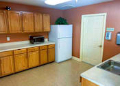 Thumbnail 12 of 15 - Spacious community room featuring large shared kitchen at Park View at South Pantops where residents age 62 and better enjoy social events, educational activities, and entertainment opportunities.