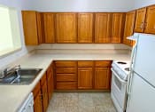 Thumbnail 13 of 15 - Modern, full kitchen in a senior apartment at Park View at South Pantops, complete with energy-efficient appliances, ample cabinetry, and easy-to-clean surfaces for convenience and safety.