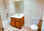 Thumbnail 15 of 15 - Well-lit bathroom featuring enhanced safety features and medical emergency pull cords, designed with seniors' needs in mind at Park View at South Pantops.