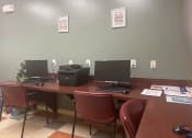 Thumbnail 8 of 11 - a desk with two computers and a printer on it