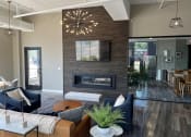 Thumbnail 5 of 55 - a living room with a fireplace and a tv on the wall