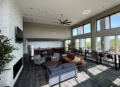 Thumbnail 11 of 55 - a large living room with couches and chairs and a kitchen with a large window