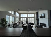 Thumbnail 14 of 55 - a large living room with lots of windows and furniture