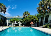 Thumbnail 17 of 18 - a swimming pool in front of a building
