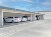 Thumbnail 35 of 35 - A parking garage with several cars parked in it.
