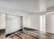 Thumbnail 18 of 24 - A room with a white wall and a white door.
