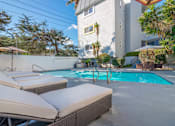 Thumbnail 22 of 24 - Pool and furnished lounging area
