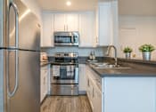 Thumbnail 8 of 19 - Kitchen with new counters and appliances