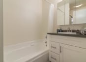 Thumbnail 12 of 19 - bathroom tub and vanity