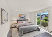 Thumbnail 8 of 14 - A bedroom with a large bed and a painting on the wall.