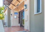 Thumbnail 3 of 12 - Front door of building