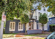 Thumbnail 2 of 14 - A blue house with a no parking sign in front.
