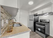 Thumbnail 10 of 64 - Two Bedroom Kitchen at Sunset Square Apartments, West Covina