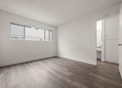 Thumbnail 38 of 64 - Bedroom with large closet and natural lighting at Sunset Square Apartments, California, 91790