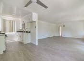 Thumbnail 4 of 9 - Kitchen and living room view from dining area