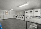 Thumbnail 64 of 64 - Rows of washers and dryers for laundry at Sunset Square, West Covina, 91790