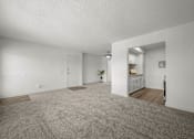 Thumbnail 31 of 64 - A spacious room with a grey carpet and white walls at Sunset Square, West Covina, 91790