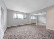 Thumbnail 33 of 64 - empty living room at Sunset Square, West Covina, CA