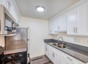 Thumbnail 4 of 13 - view of Kitchen and refridgerator