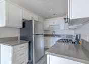 Thumbnail 12 of 35 - a kitchen and living room in a 1130 Marine unit