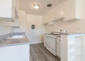 Thumbnail 7 of 25 - Kitchen with new flooring and countertops
