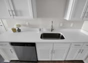 Thumbnail 6 of 36 - Stainless steel sink with beautiful countertops and cabinets  at Huntington Apartments, North Carolina