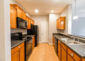 Thumbnail 13 of 36 - Kitchen view with all appliances  at Huntington Apartments, Morrisville, 27560  and natural light