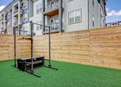 Thumbnail 11 of 45 - a backyard with synthetic grass and a wood fence in Asheville NC