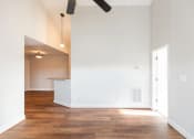 Thumbnail 4 of 36 - Spacious living area with ceiling fan and hardwood floors  at Huntington Apartments, North Carolina, 27560