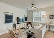 Thumbnail 5 of 45 - a living room with a couch chair and tv in Asheville