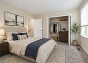 Thumbnail 8 of 21 - A bedroom with a large bed and a wardrobe.