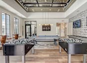 Thumbnail 17 of 45 - a games room with foosball tables and a ping pong table in Asheville NC