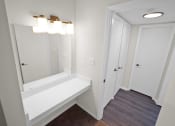 Thumbnail 12 of 36 - Vanity with mirror and lighting  at Huntington Apartments, Morrisville, NC, 27560