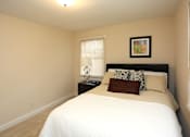 Thumbnail 6 of 14 - View of bedroom model with bed and nightstand