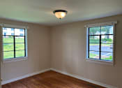 Thumbnail 8 of 14 - an empty room with two windows