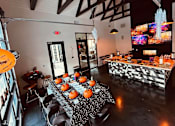 Thumbnail 41 of 45 - a dining room with a table with pumpkins on it