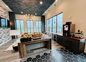 Thumbnail 45 of 45 - a tasting room with a large table and a counter in the middle