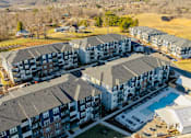Thumbnail 40 of 45 - an aerial view of apartments and a swimming pool in a city