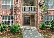 Thumbnail 9 of 46 - A brick building with the number 2435 on the balcony.