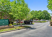 Thumbnail 42 of 46 - A street view of Summerlin Ridge with a green signboard.