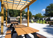 Thumbnail 32 of 36 - BBQ and picnic area  at Huntington Apartments, Morrisville, NC, 27560