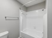 Thumbnail 15 of 29 - A white shower stall in a bathroom.